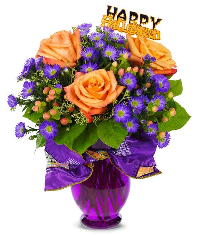 Halloween Flowers for delivery in a purple vase by a local florist. 